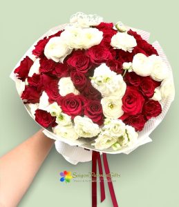 Delicate bouquet of white and red rose