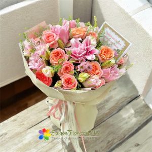 Elegant mix of roses and pink lilies