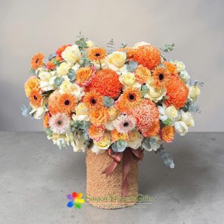 Orange flower basket for birthday free delivery sameday