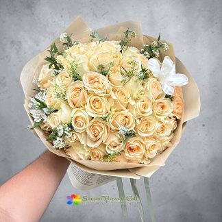 Creamy yellow roses mixed with tulips