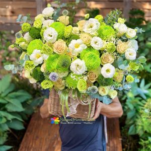 Basket of natural flowers as a gift for Mom