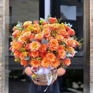 Basket of orange roses as a birthday gift