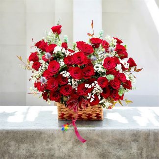 basket of red roses mixed with white baby's breath in saigon