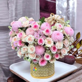 Beautiful pink heart-shaped flower basket