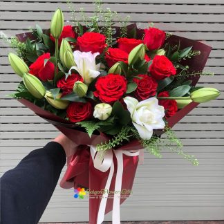 bouquet of red roses mixed with white lilies