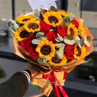 sunflowers mixed with vibrant red roses