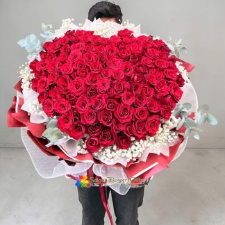 99 red roses mixed with white baby's breath